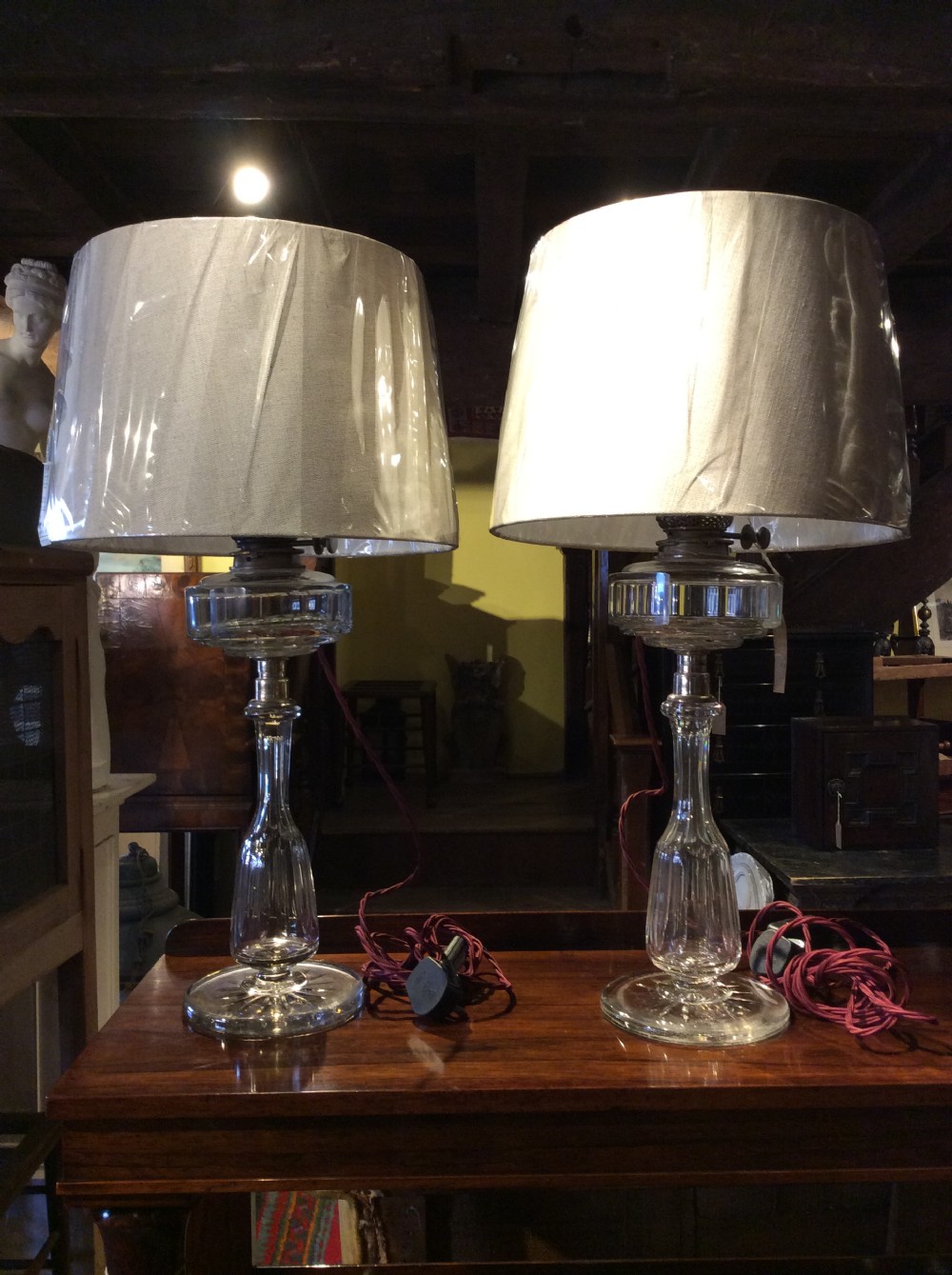 A pair of 19thC cut glass & plated silver table lamps