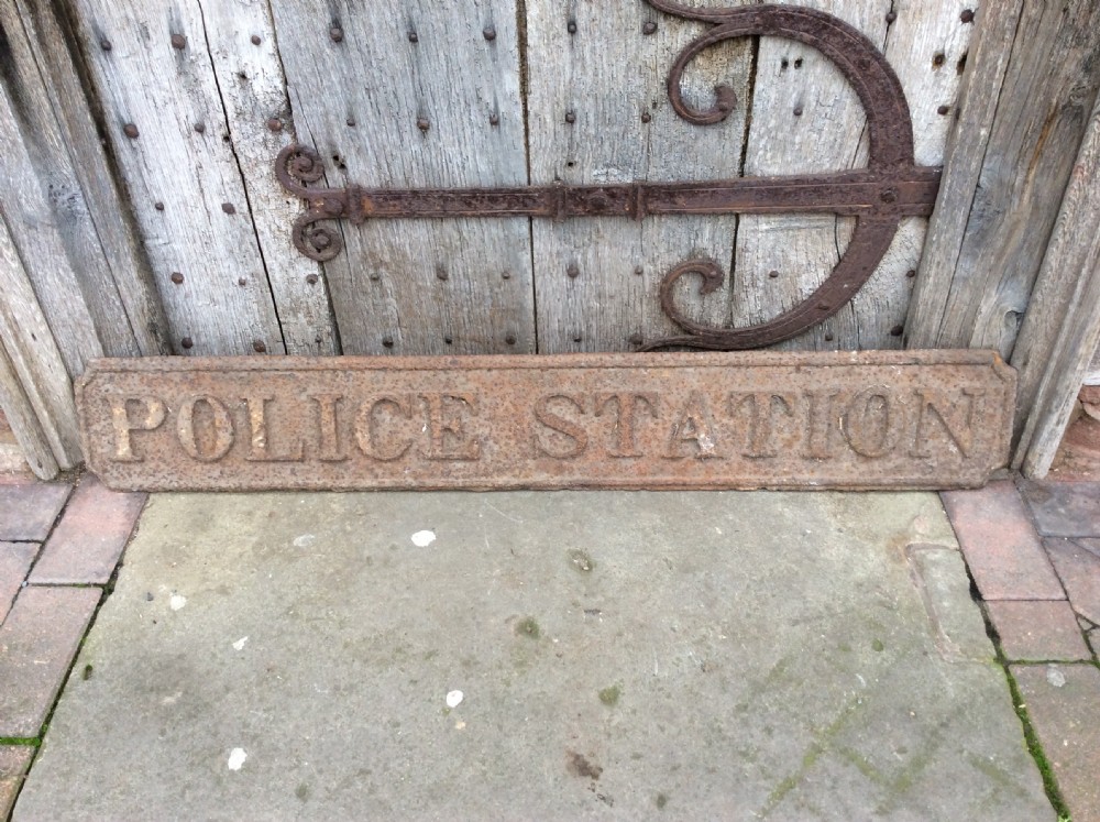 A 19thC “ Police station” sign in cast pig iron