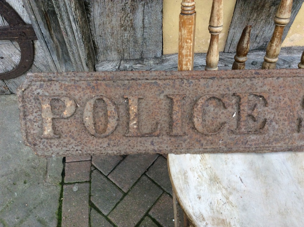 A 19thC “ Police station” sign in cast pig iron View V