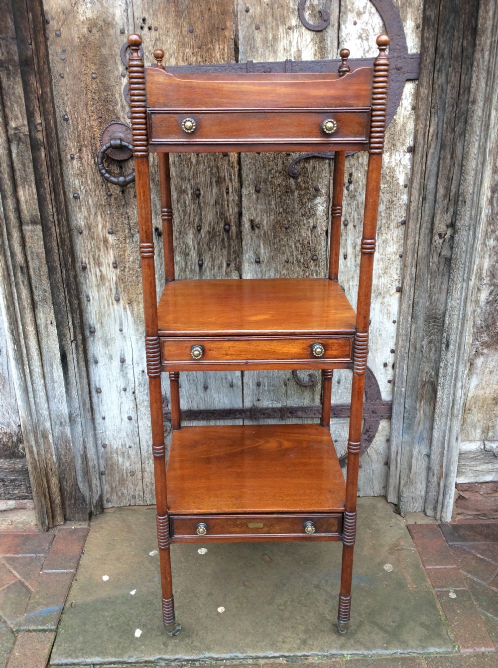 A Regency mahogany 4 tear & 3drawer Scottish Whatnot