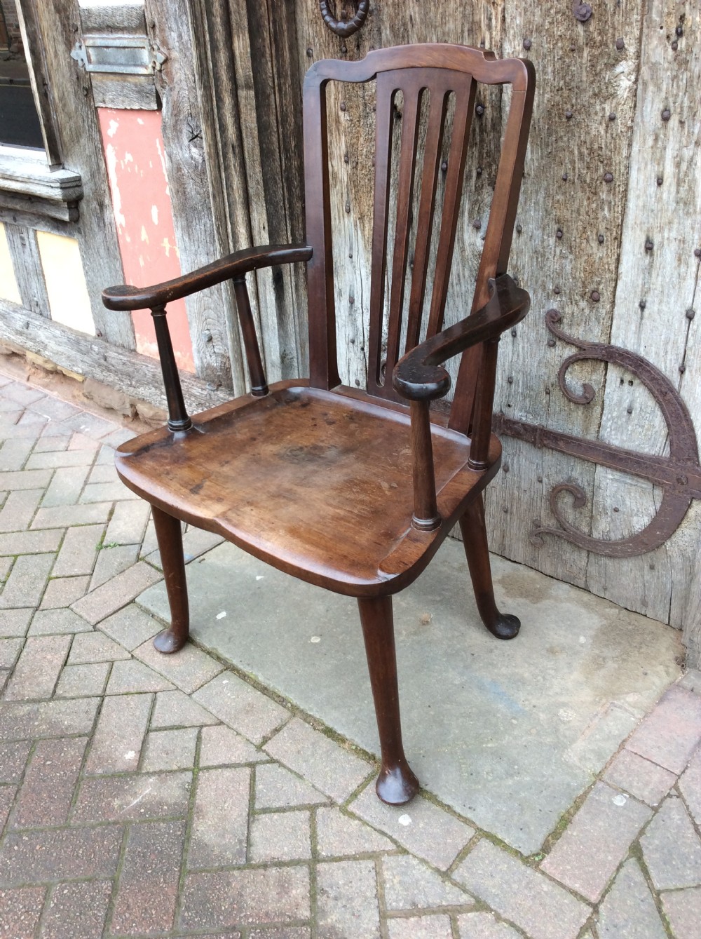 A 19thC Mahogany broad seated open armchair on pad feet View II