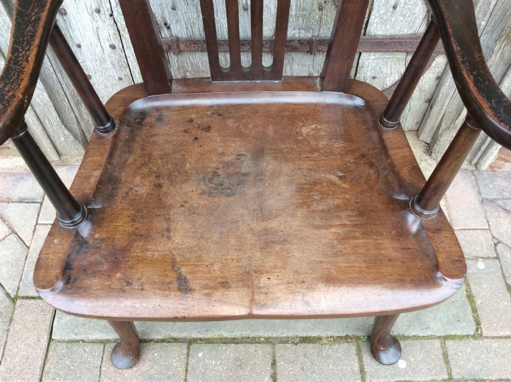 A 19thC Mahogany broad seated open armchair on pad feet View VI