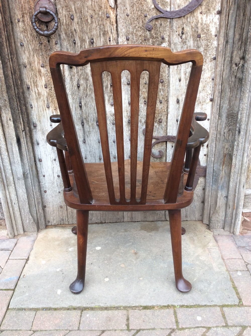 A 19thC Mahogany broad seated open armchair on pad feet View VIII