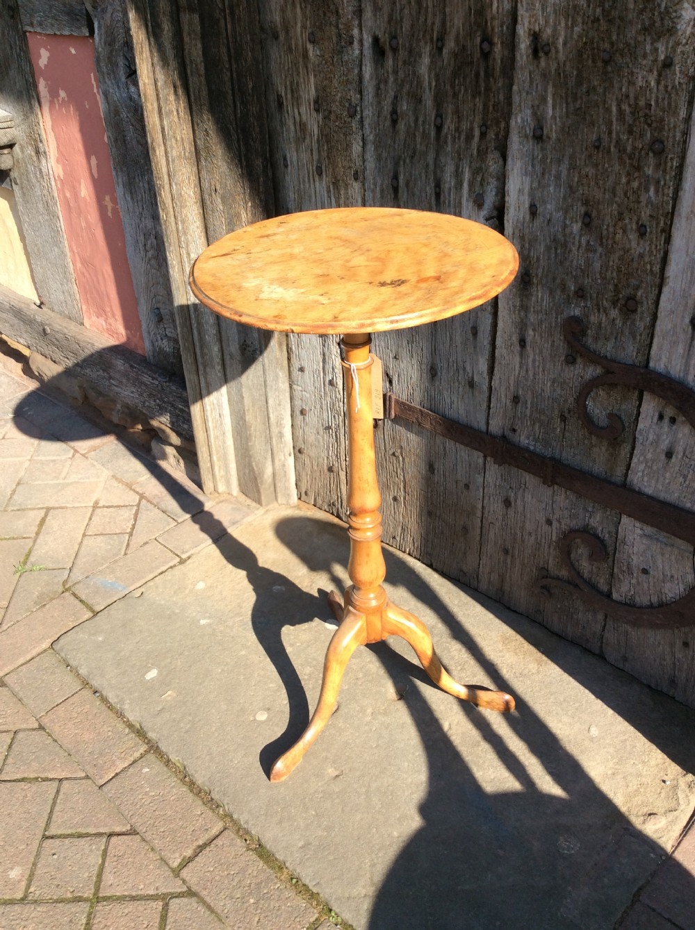 A 19thC birchwood tripod table attributed to Holland & Sons View II