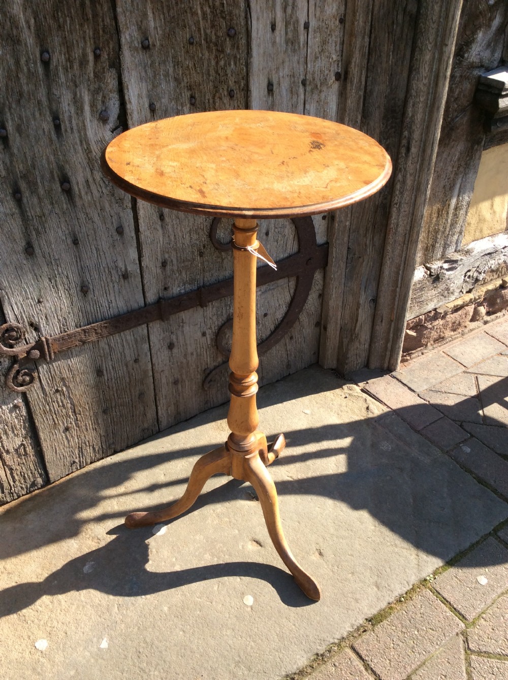 A 19thC birchwood tripod table attributed to Holland & Sons View III