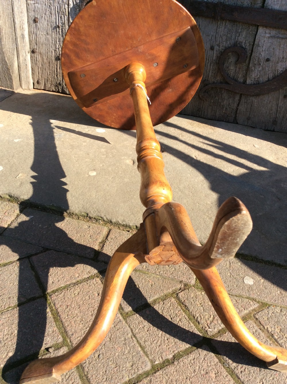 A 19thC birchwood tripod table attributed to Holland & Sons View IV