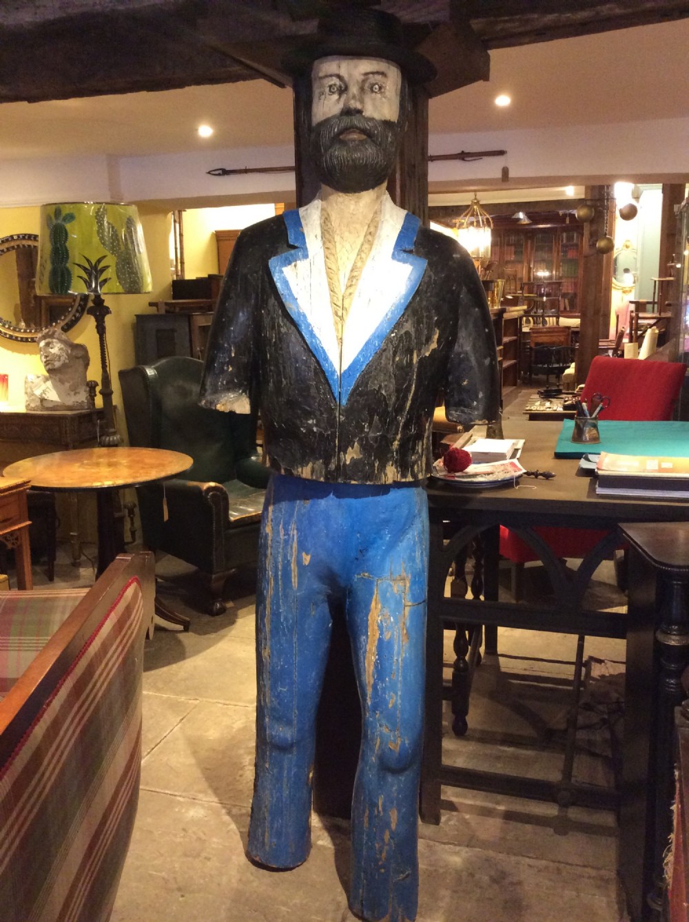 A 19thC carved & painted pine sailor and its own iron anchor