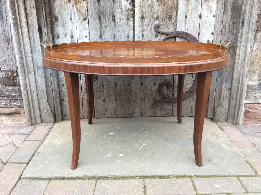 An 18thC mahogany oval tray on later stand