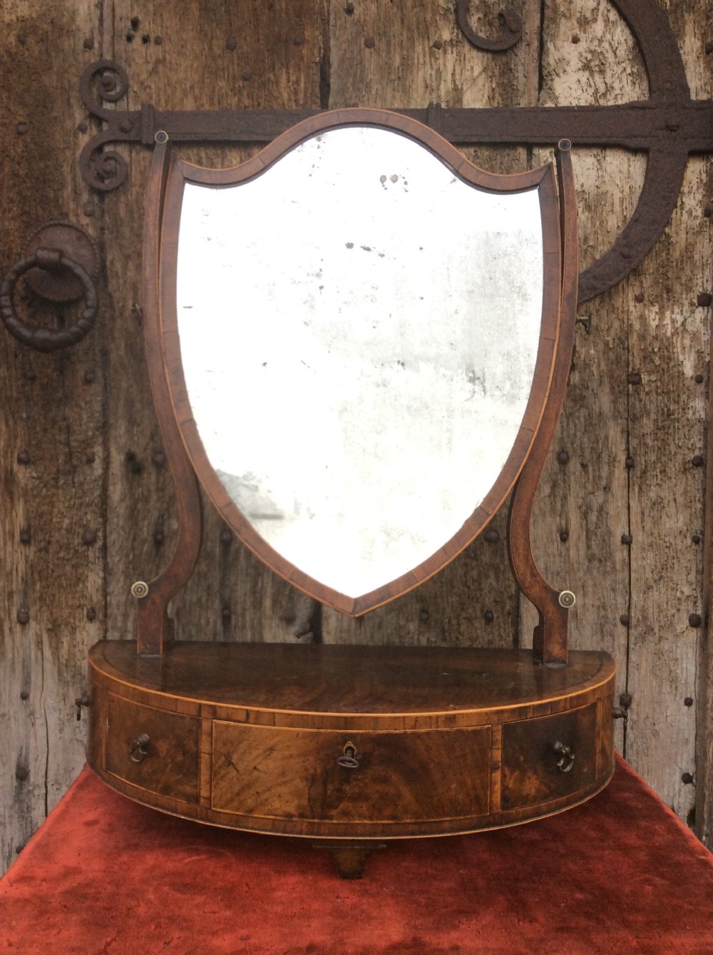 A late 18thC mahogany demi-lune table mirror