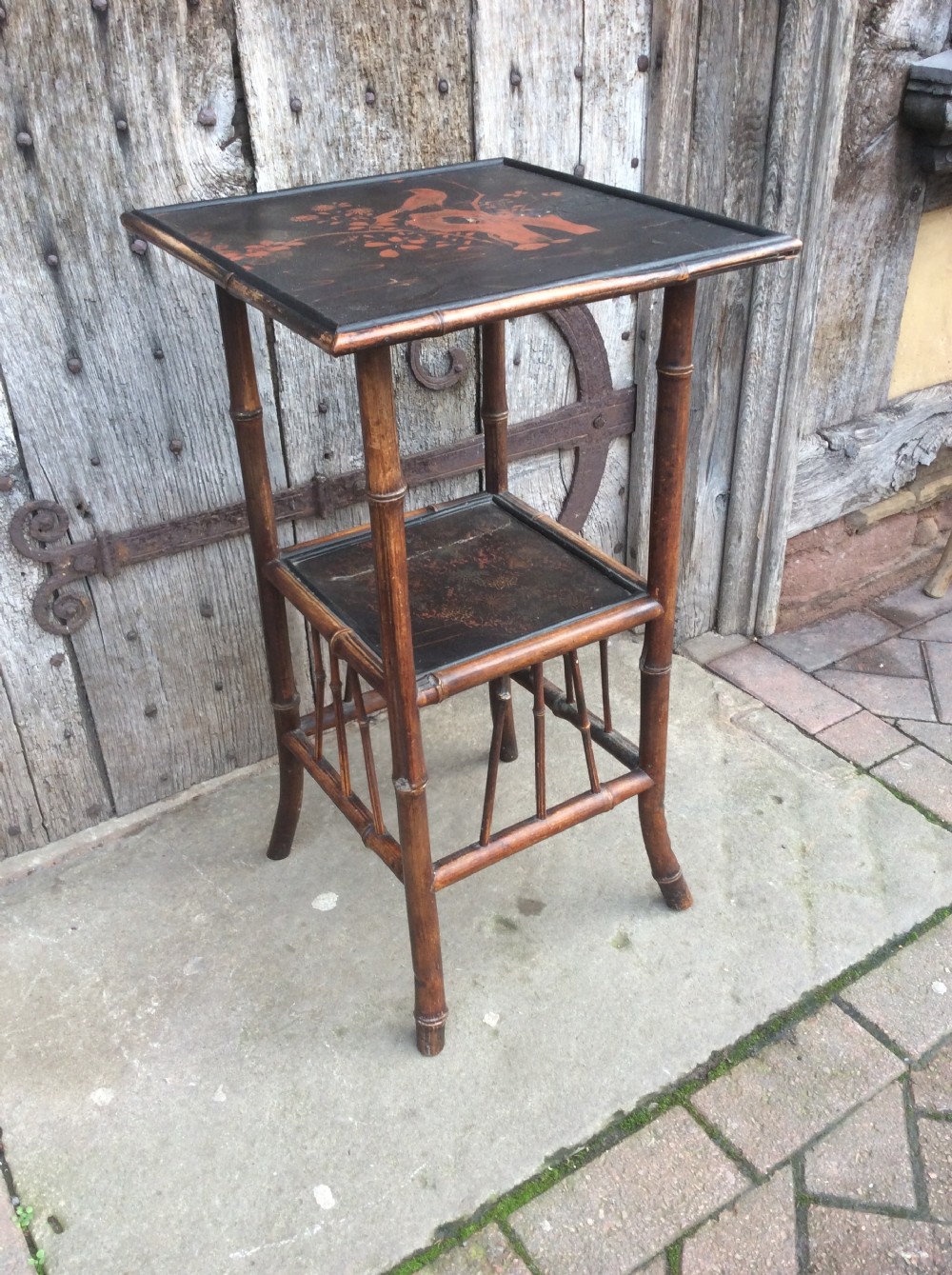 A 19thC bamboo and lacquered decorated lamp table