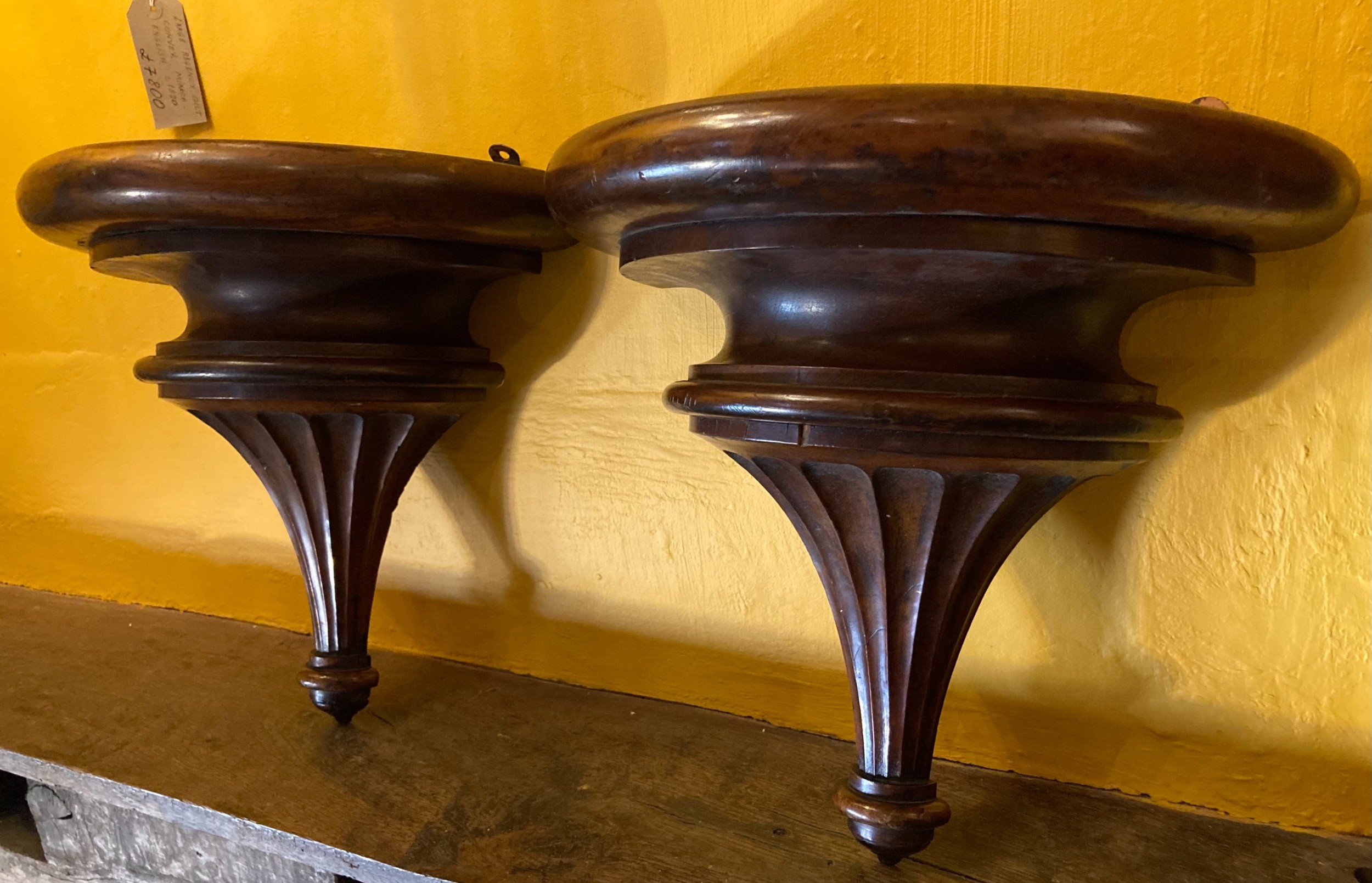 A pair of 19th century mahogany wall brackets