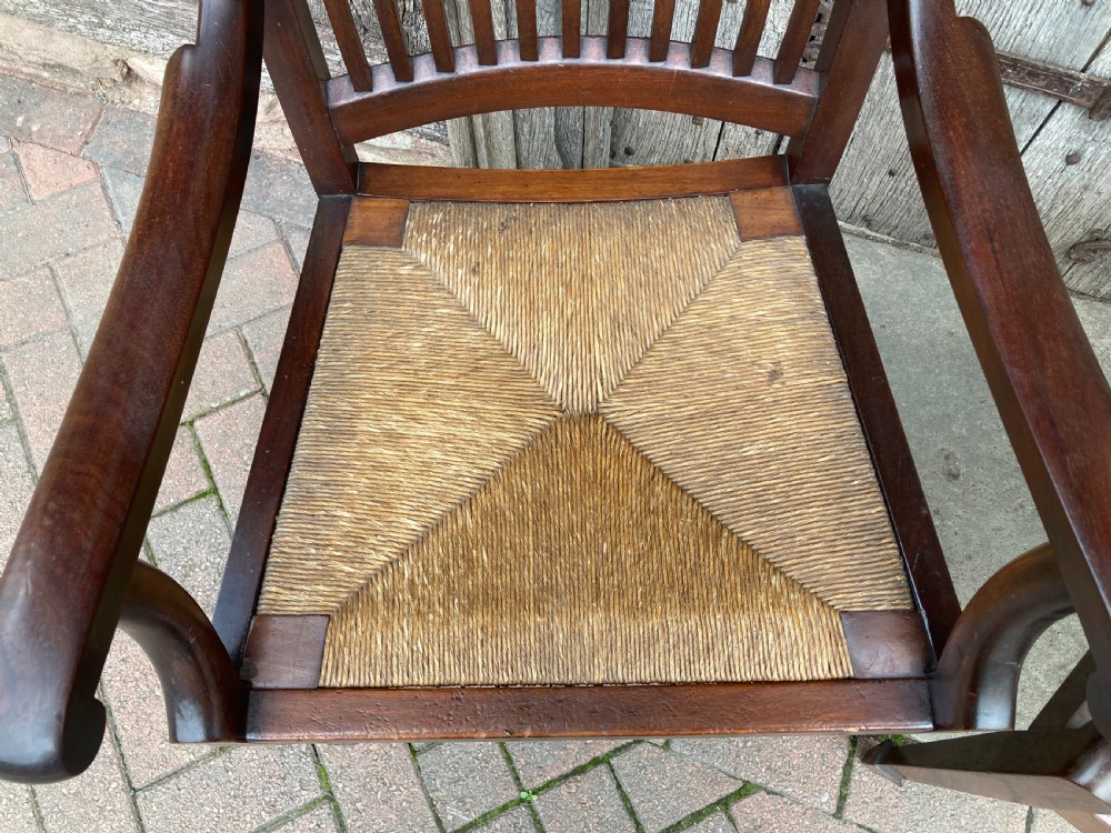 A pair of early 20th century mahogany rush-seated armchairs c 1910 View IV