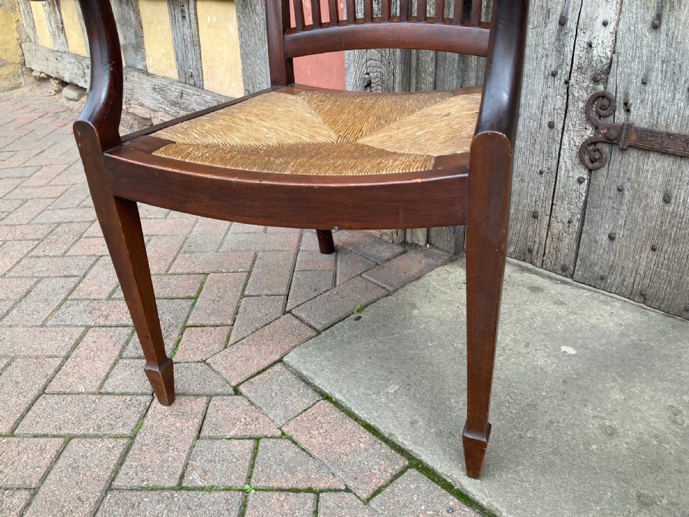 A pair of early 20th century mahogany rush-seated armchairs c 1910 View VII