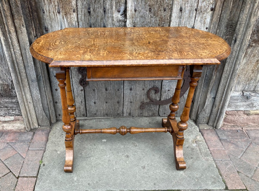 A 19th-century Hungarian ash side table featuring a single drawer with a dark knob, shaped aprons, and turned legs joined by a central stretcher. View VIII