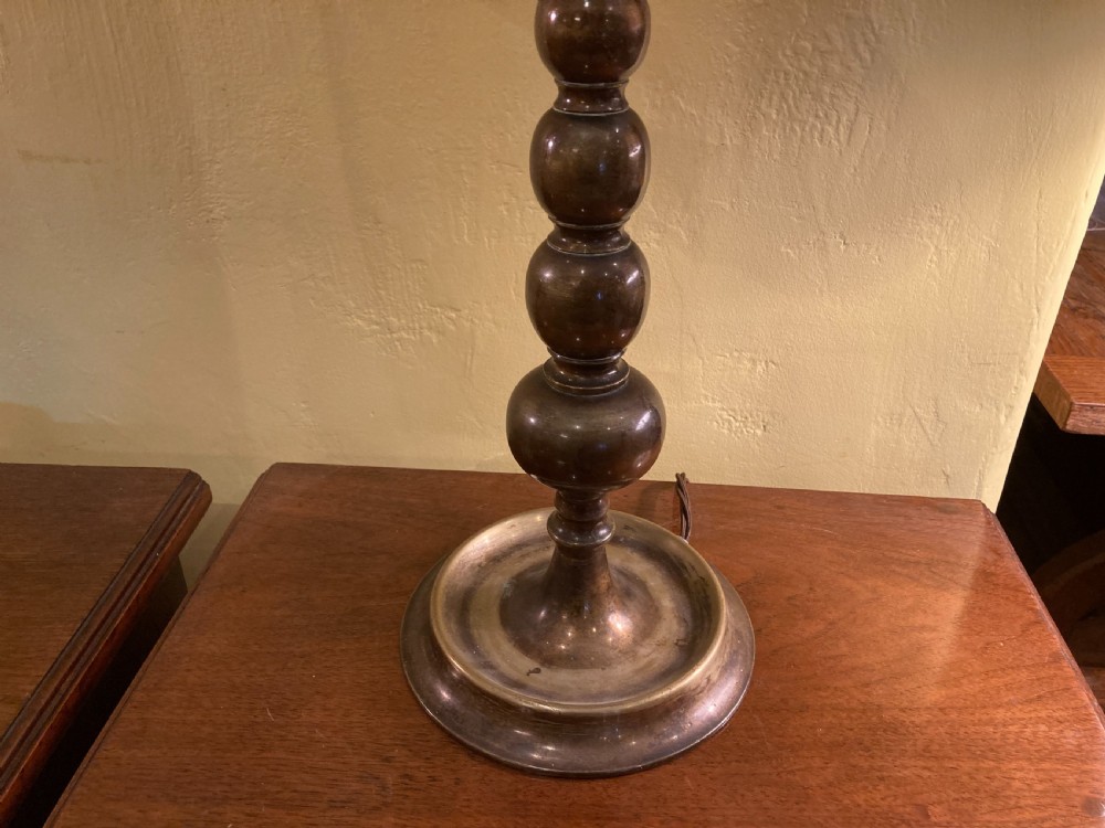 A pair of 19th century patinated brass bobbin table lamps View II