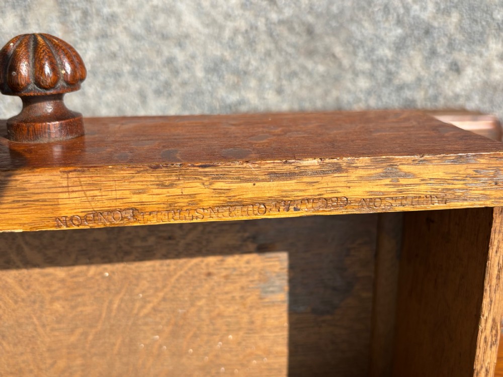 A 19th-century oak partners desk featuring a green leather inset top, two pedestals with multiple drawers, and carved wooden handles. View XI