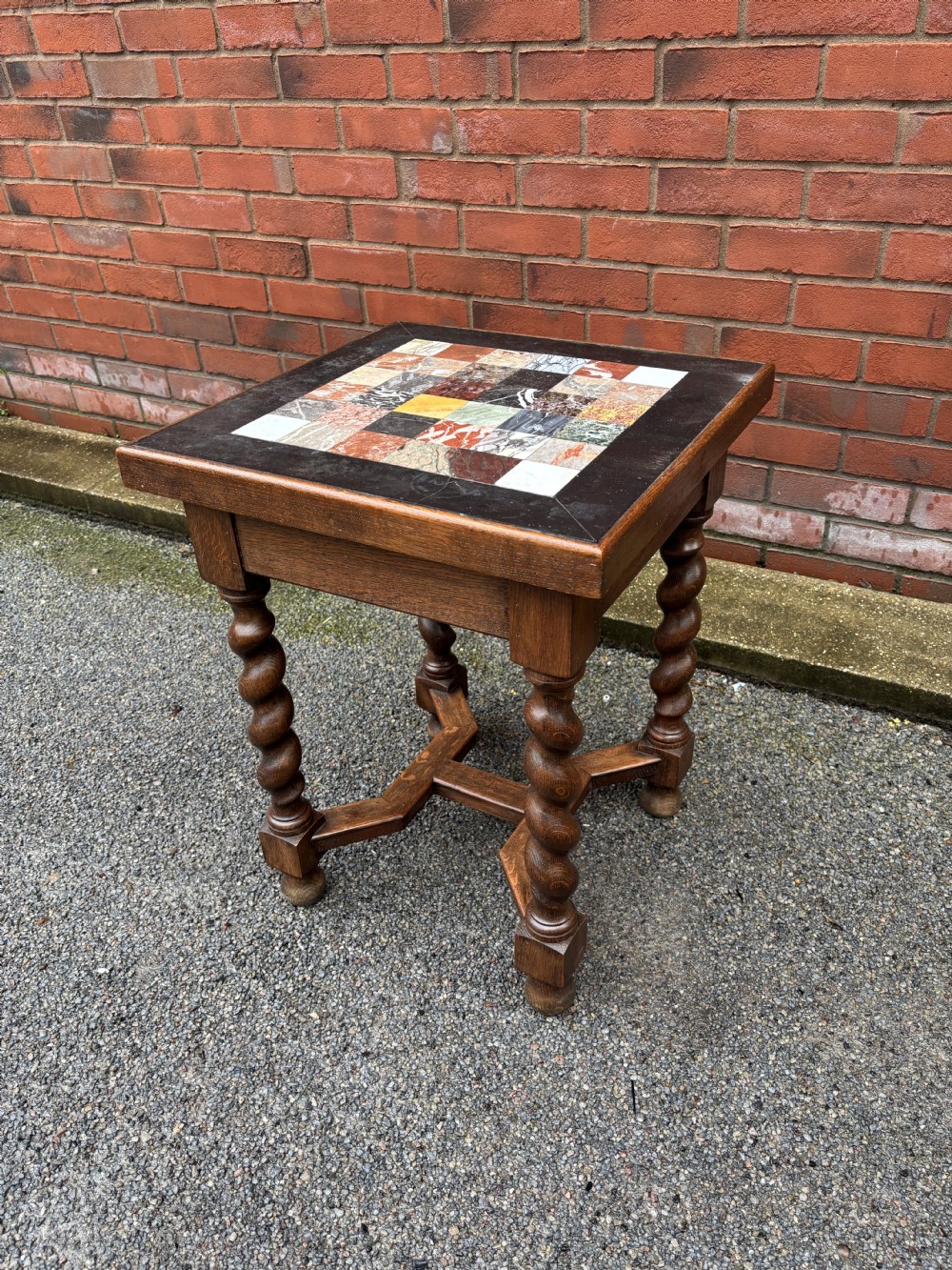 A 19th-century oak side table featuring a chequered specimen marble inset top supported by four barley twist legs and joined stretchers. View IV