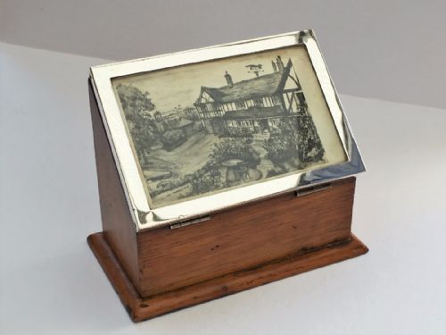 An Unusual Stationary Box and Silver Photo Frame Combo