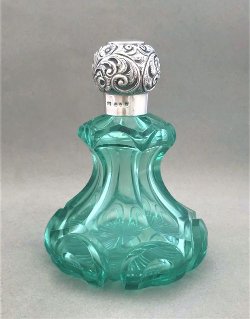 A Stunning Large Silver Mounted Perfume Bottle