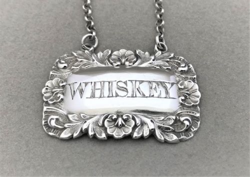 fig 1. A silver Whiskey decanter label from 1845