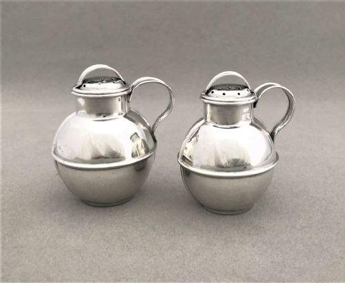 A Novelty Pair of Silver 'Guernsey Cream Jug' Pepper Pots