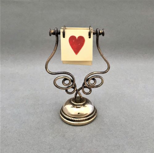 A Gorgeous Art Nouveau Brass Trump Marker