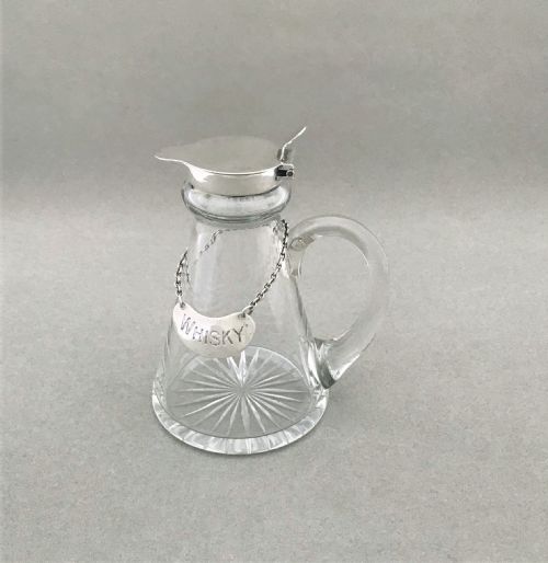 A Lovely Silver Mounted Whisky Tot with Original Silver Label