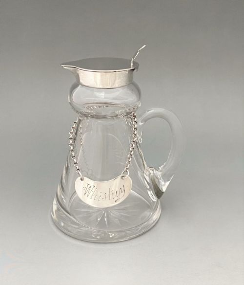 A Handsome Silver Whisky Tot with Silver Label
