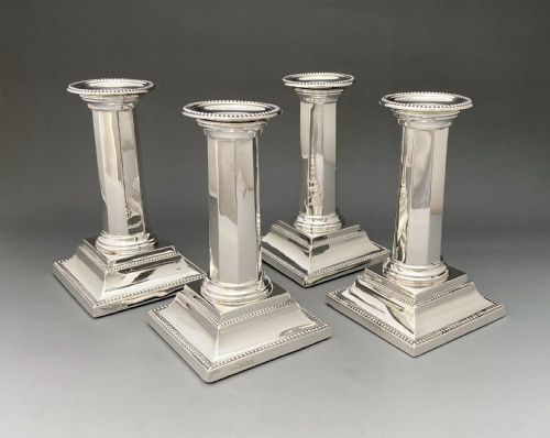 A Rare Set of Four Art Deco Silver Candlesticks
