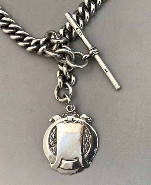 fig 1. A wonderful George V silver Albert chain with silver fob