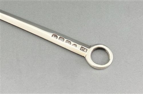 fig 1. A tapered Georgian sterling silver game skewer featuring a smooth ring handle and stamped hallmarks near the top.