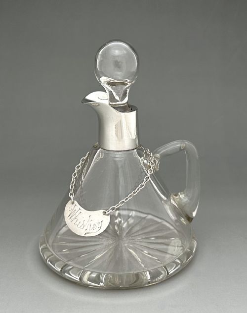 A Superb Silver Mounted Whisky Tot with Silver Label