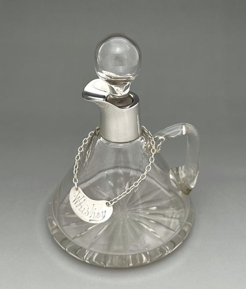 fig 1. A superb silver mounted Whisky tot with silver label