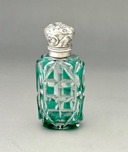 A GORGEOUS VICTORIAN SILVER MOUNTED OVERLAY SCENT BOTTLE