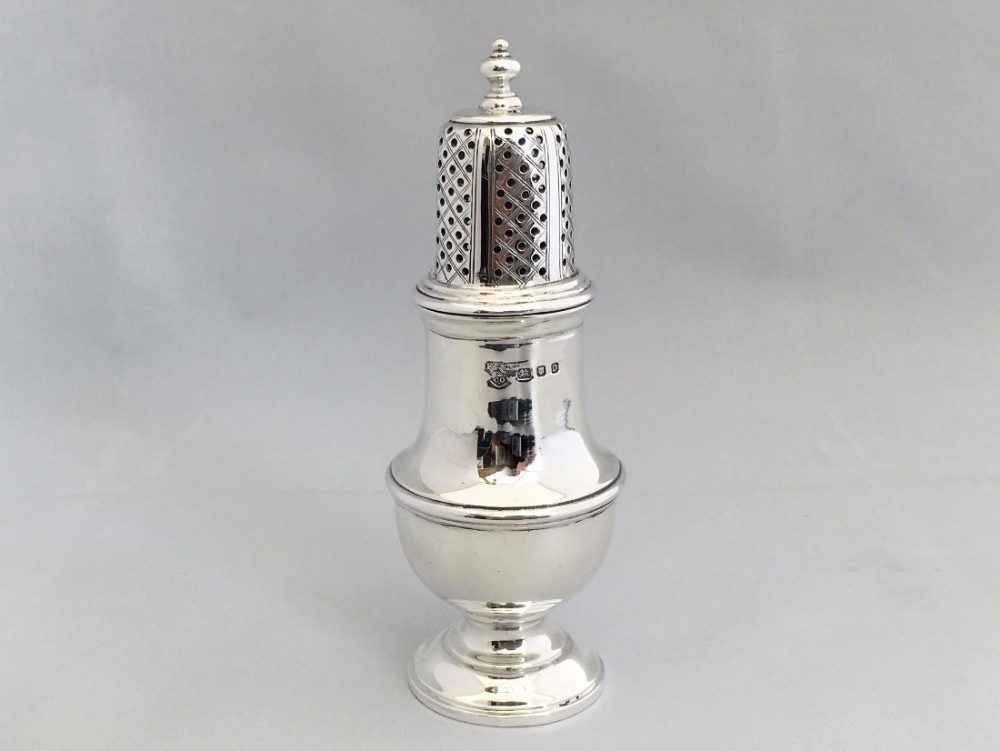 An attractive silver baluster pepper caster.