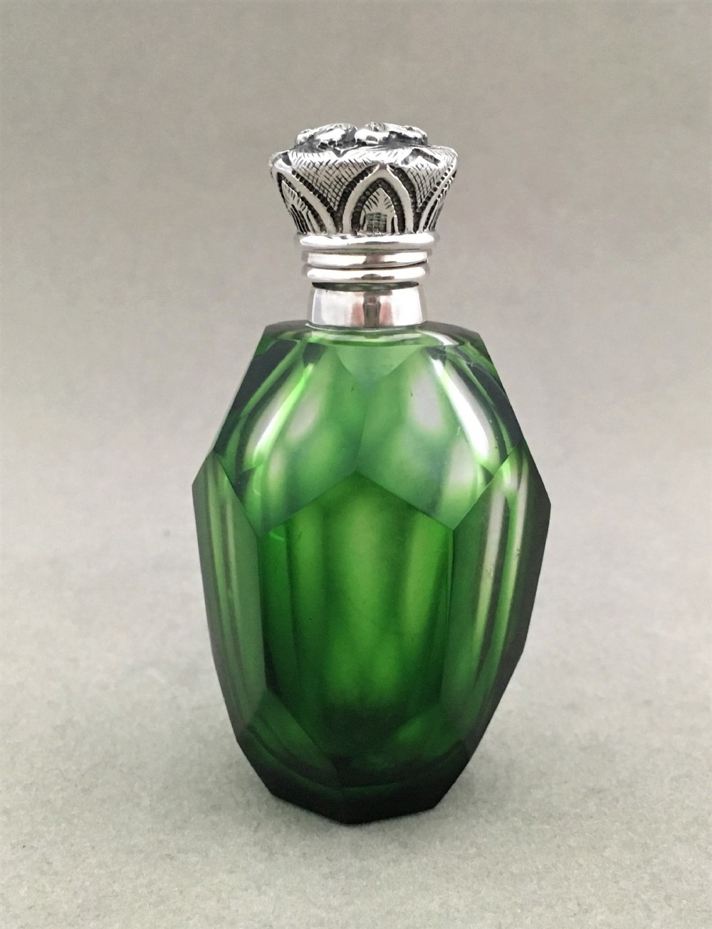 A Wonderful emerald green silver mounted scent bottle