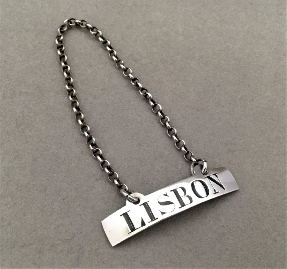A Rare 18th Century silver Lisbon wine label - Female silversmith