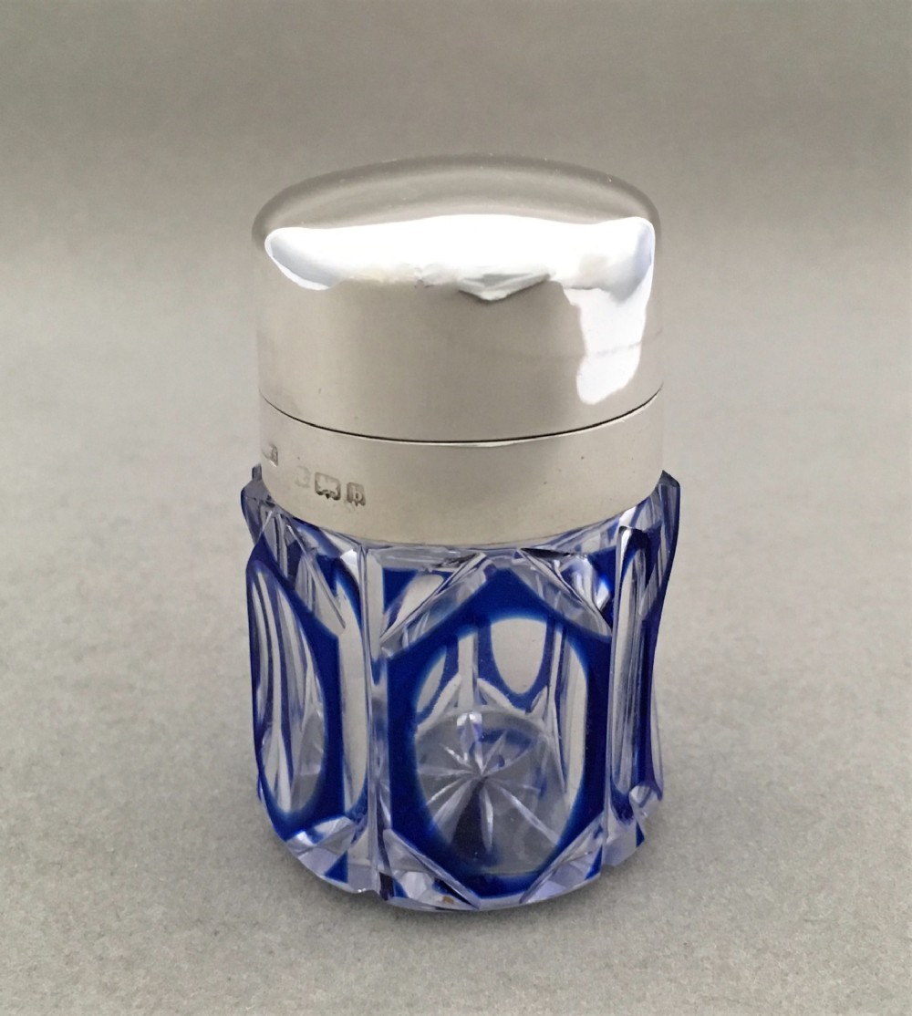 A silver mounted bristol blue cut through scent bottle