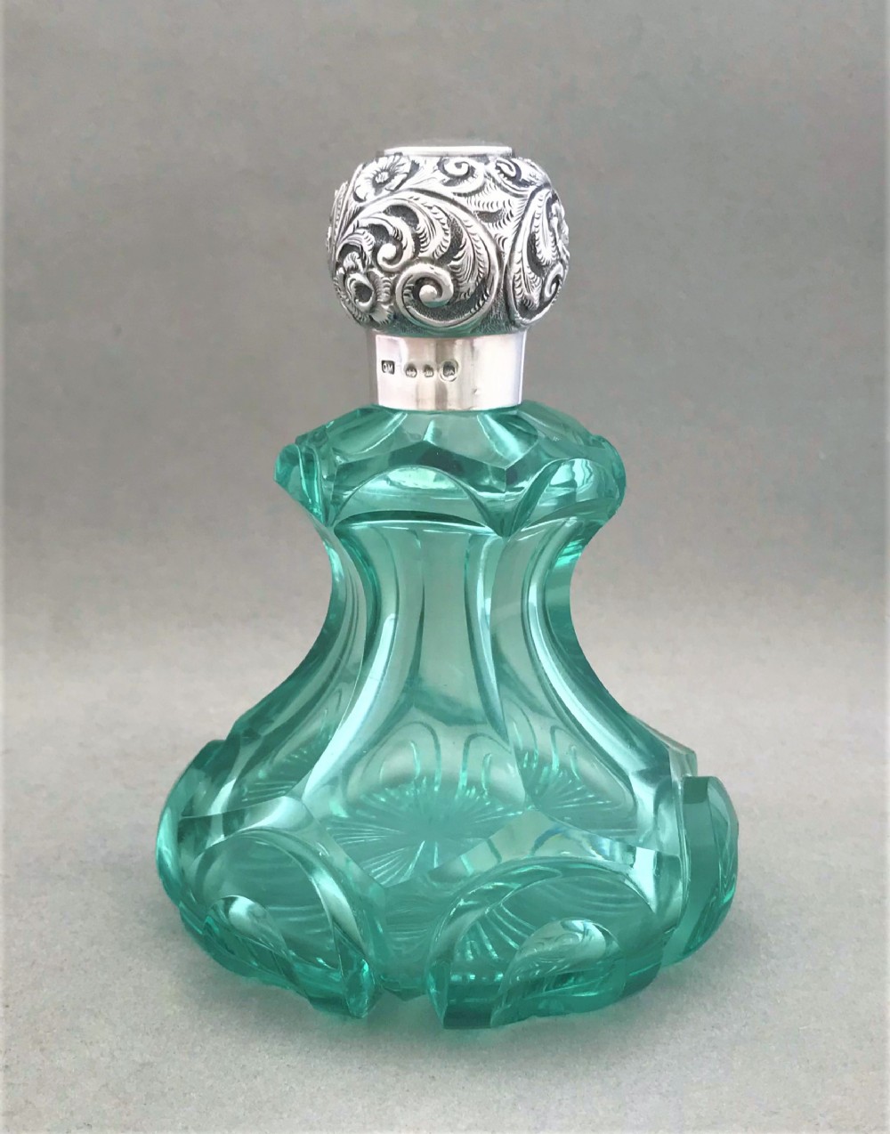 A stunning large silver mounted perfume bottle