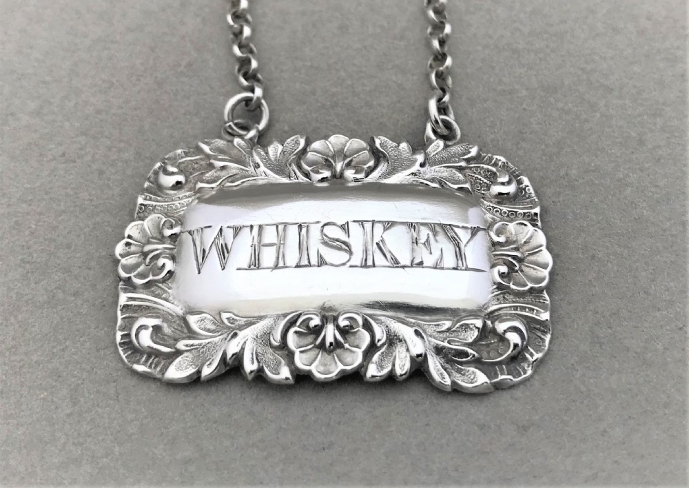 A silver Whiskey decanter label from 1845 View II