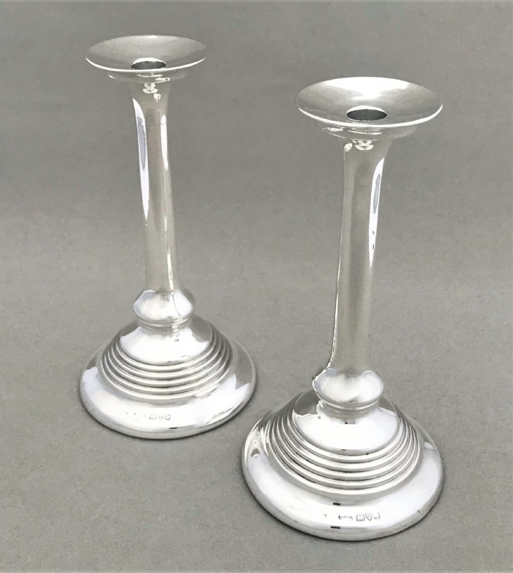 A stylish pair of Chester silver candlesticks
