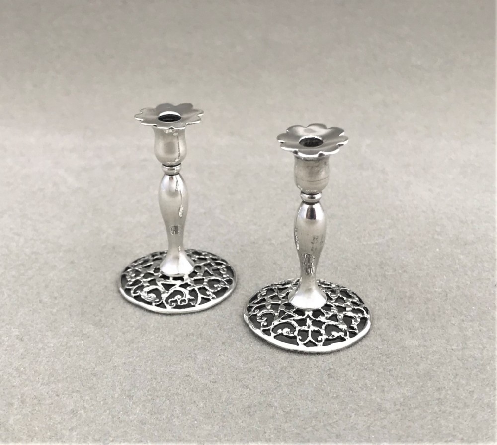 A rare pair of William Comyns silver dolls house miniature candlesticks