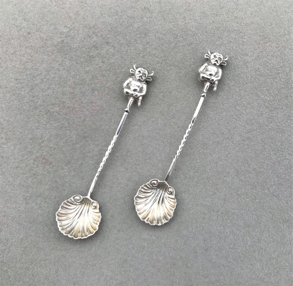 A rare pair of silver 'Lincoln Imp' salt spoons