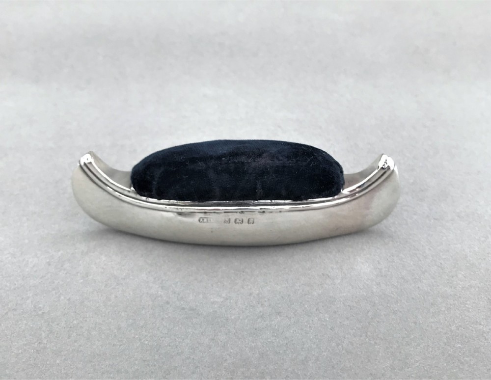 A rare Edwardian silver novelty 'canoe' pin cushion