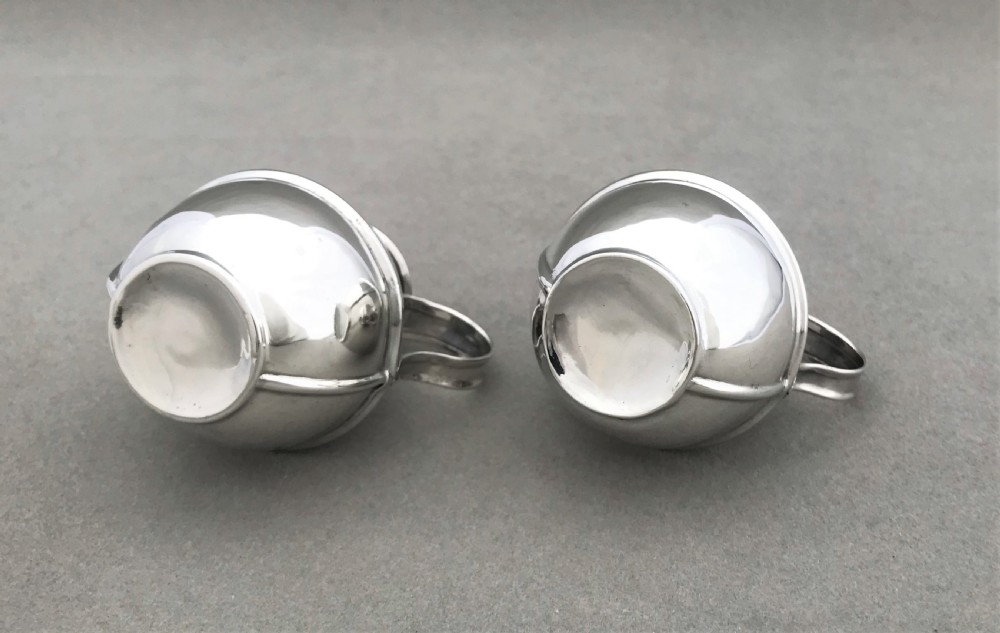 A novelty pair of silver 'Guernsey cream jug' pepper pots View VII