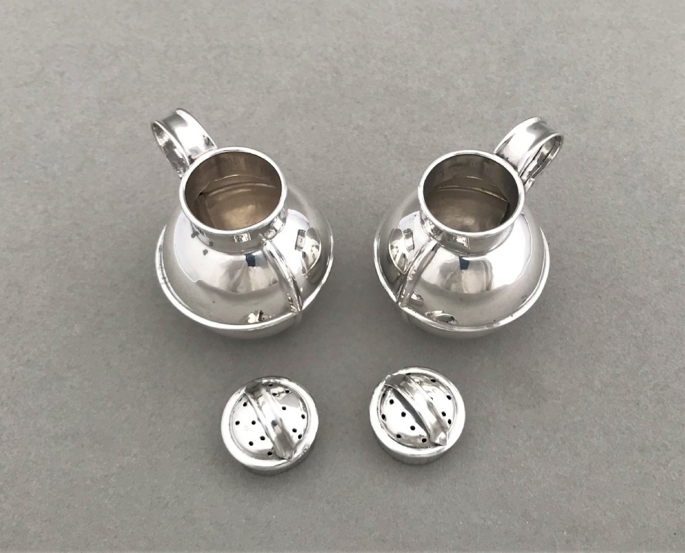 A novelty pair of silver 'Guernsey cream jug' pepper pots View VIII