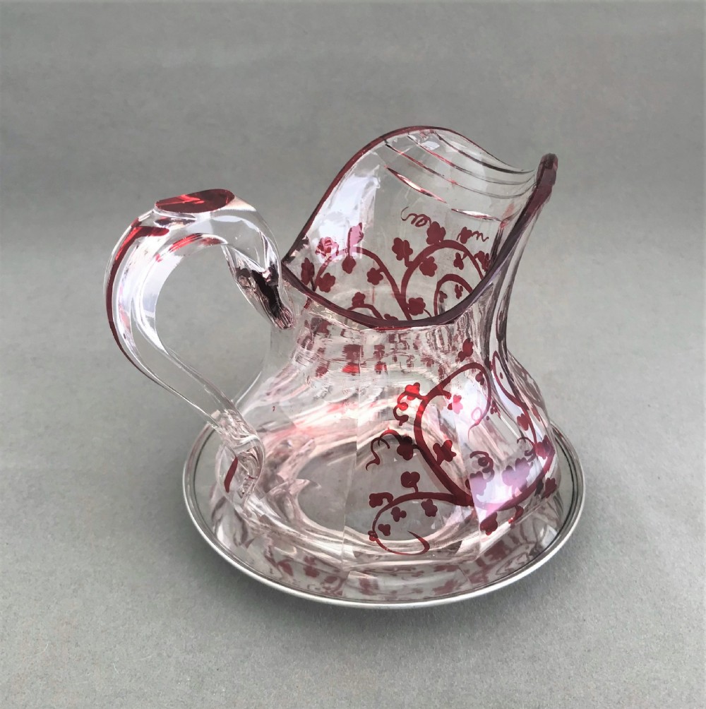 A gorgeous cut glass cream jug with silver drip saucer View III