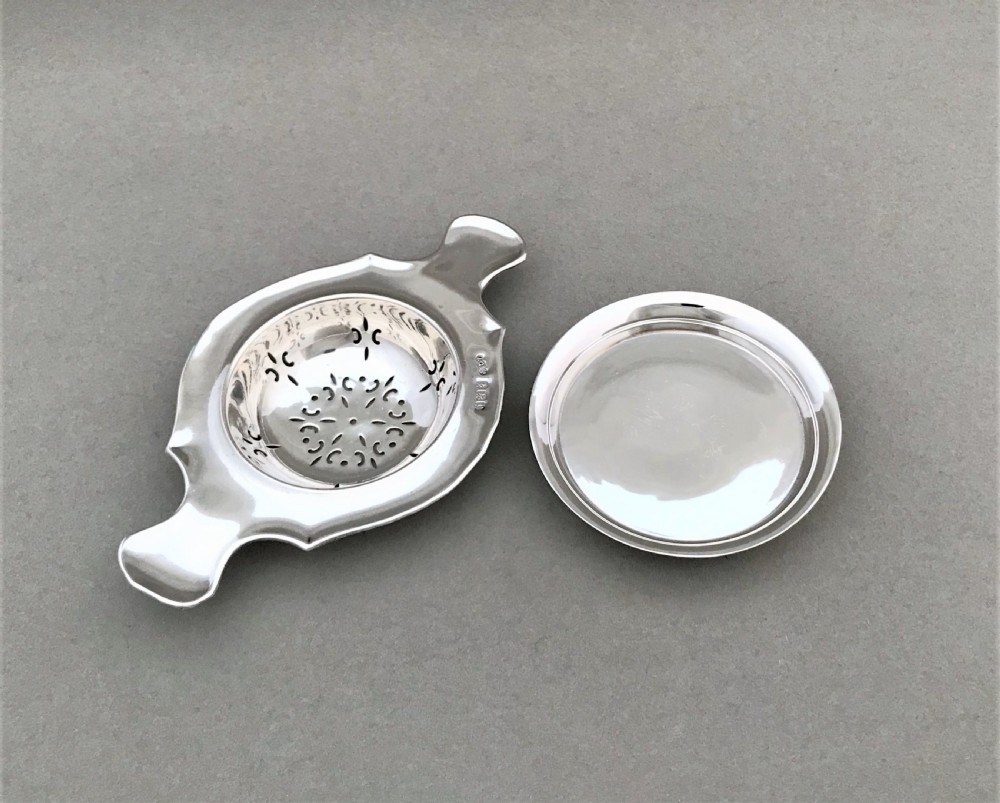 A gorgeous silver tea strainer and drip stand View III