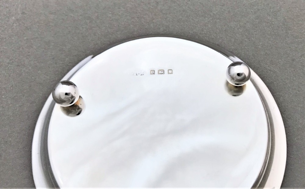 A gorgeous silver tea strainer and drip stand View IV