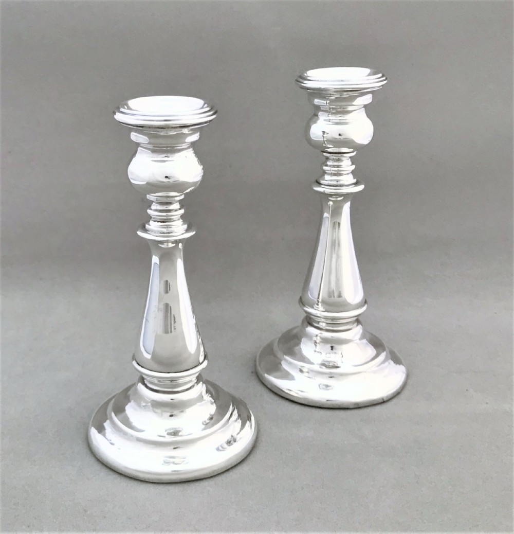 A handsome pair of Chester silver candlesticks